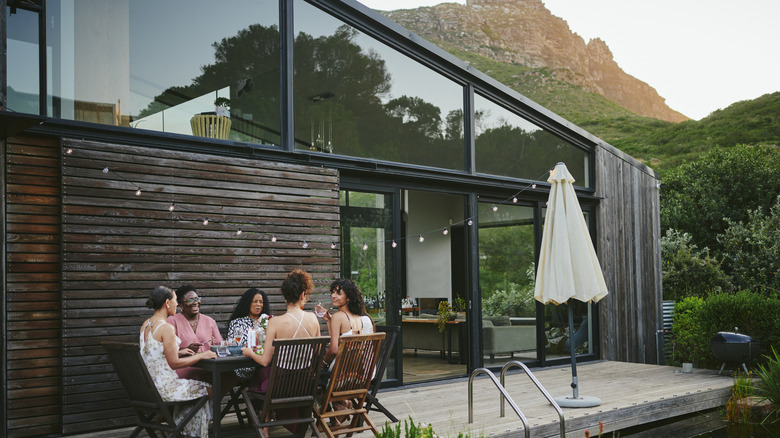 People sitting on a deck with no privacy