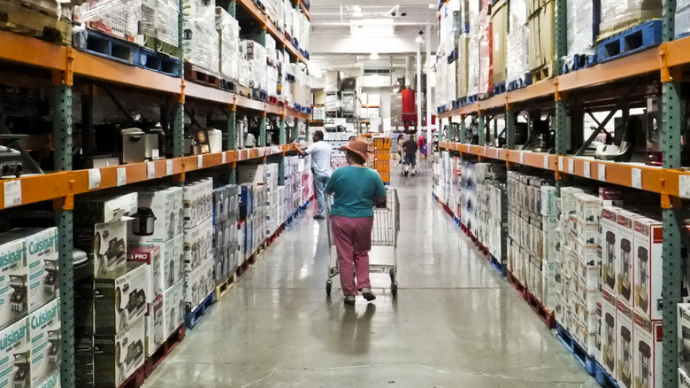 A person shopping the home aisle at Costco