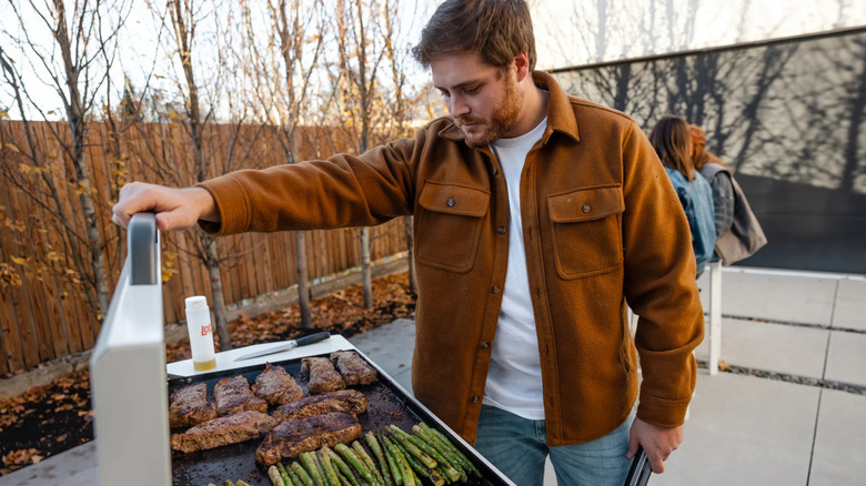 a man cooks on a LoCo griddle