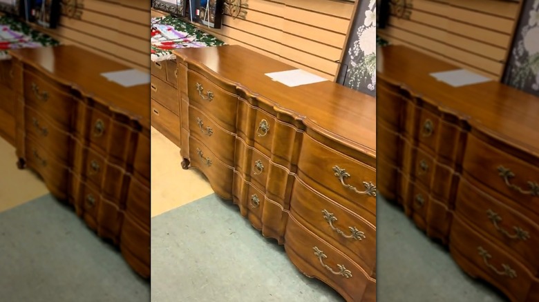 A John Widdicomb dresser in a thrift store