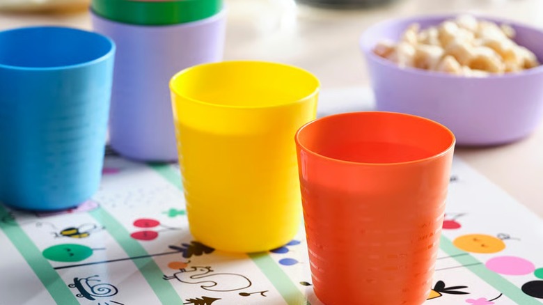 Colorful KALAS tumblers placed on the page of a coloring book