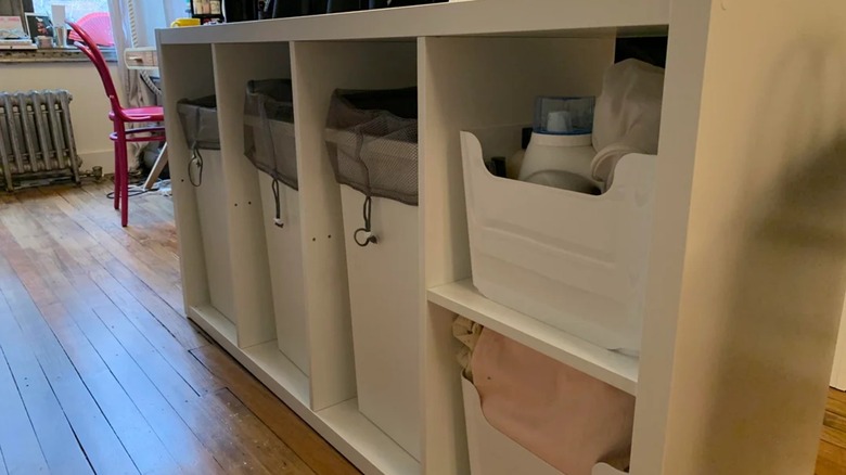 IKEA KALLAX shelving unit used to organize laundry