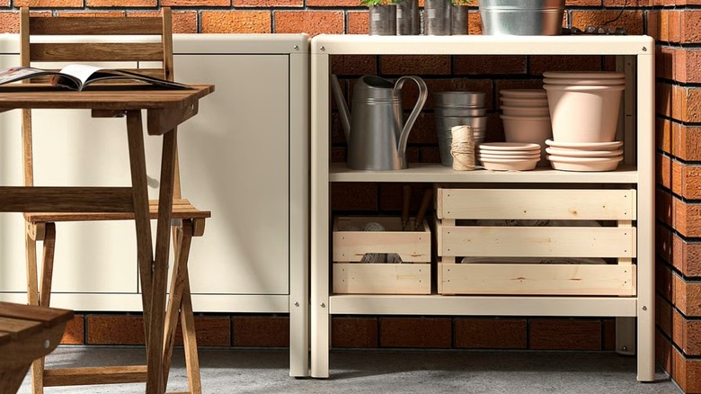 KOLBJÖRN Shelf unit full of gardening supplies