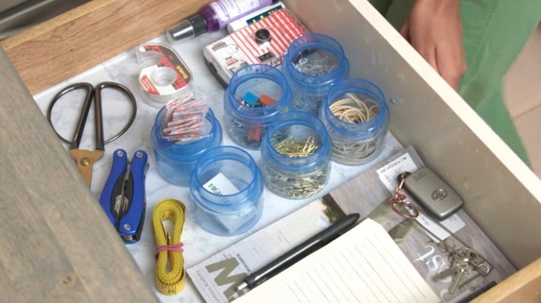 Laundry detergent lids as office drawer storage for small items