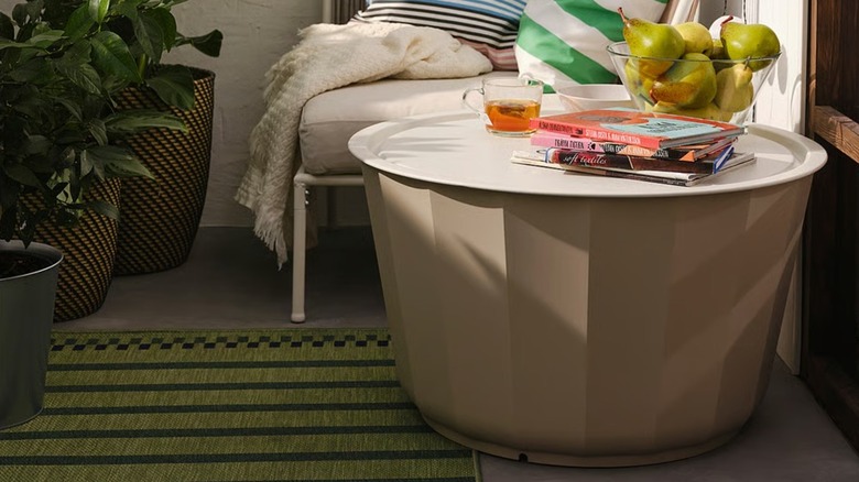 LÅGASKÄR Coffee table in small patio space in front of outdoor seat