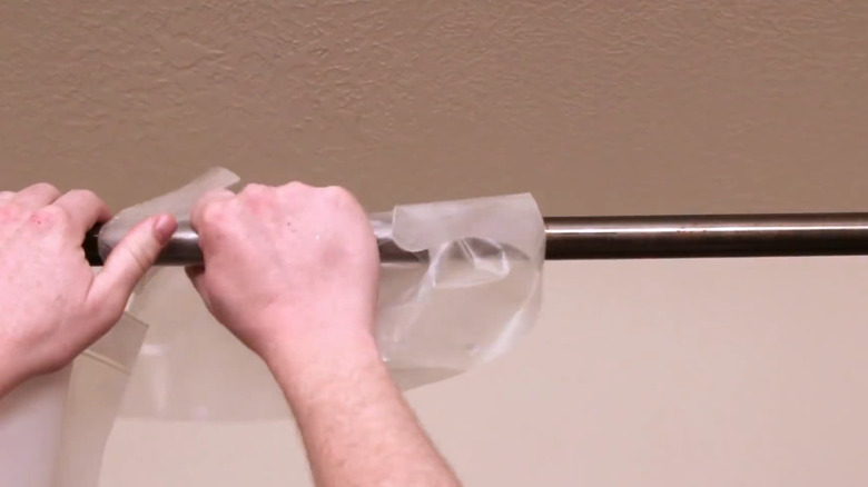 Lubricating a shower curtain rod with wax paper