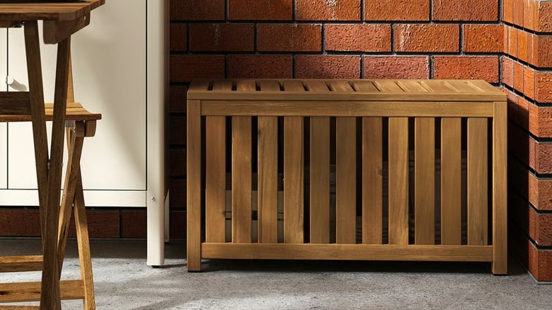 NÄMMARÖ Storage box in outdoor space in front of a brick wall