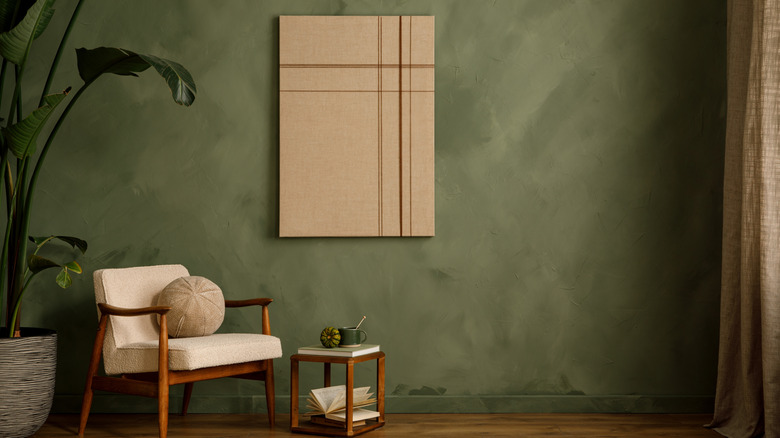 A warm-toned olive green living room