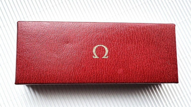 A vintage red Omega watch box