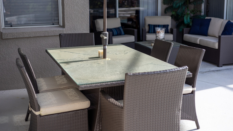 Dirty wicker dining set on a patio