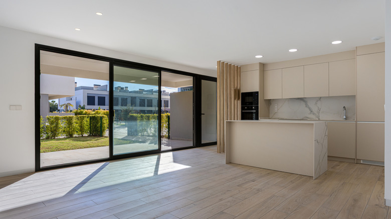 kitchen with modern black sliding glass door to the exterior