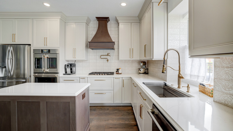 Modern kitchen with white quartz countertops