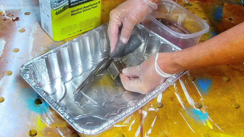 Cleaning old chest hardware in a roaster pan