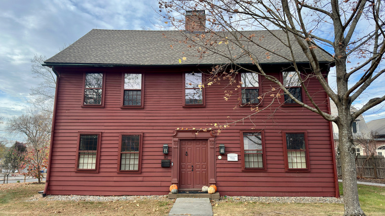 Dark red saltbox style home