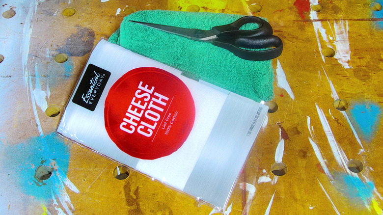Package of cheese cloth, a scissors and a kitchen towel