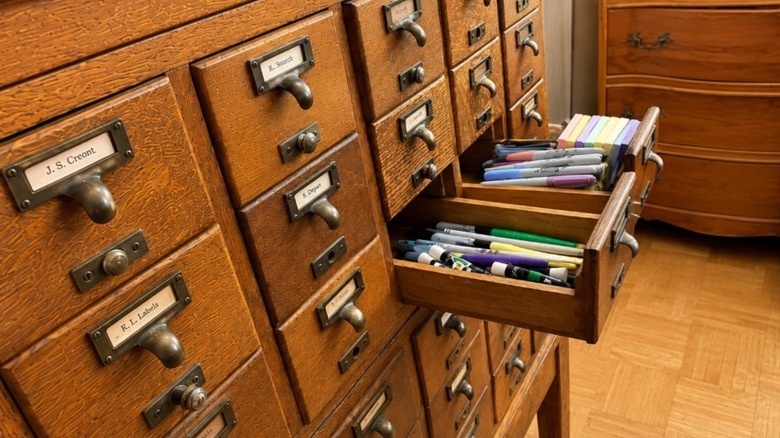 Photo of a 30 drawer card catalog set up in a home office