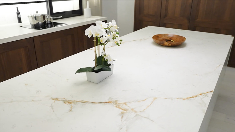 White sintered stone countertop with gold veining