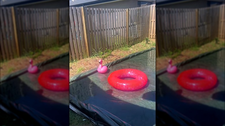 DIY pool made with pool noodles as the sides with floaties in the water