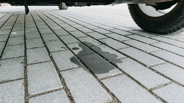 Dark oil stain on a driveway