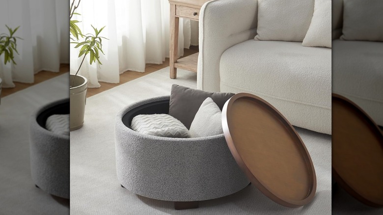 A grey boucle storage ottoman coffee table in a neutral-colored living room