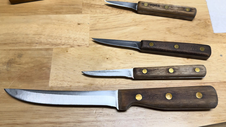 A set of four Chicago Cutlery knives