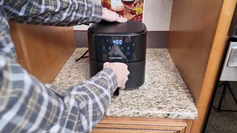 Person pulling open Chefman airfryer
