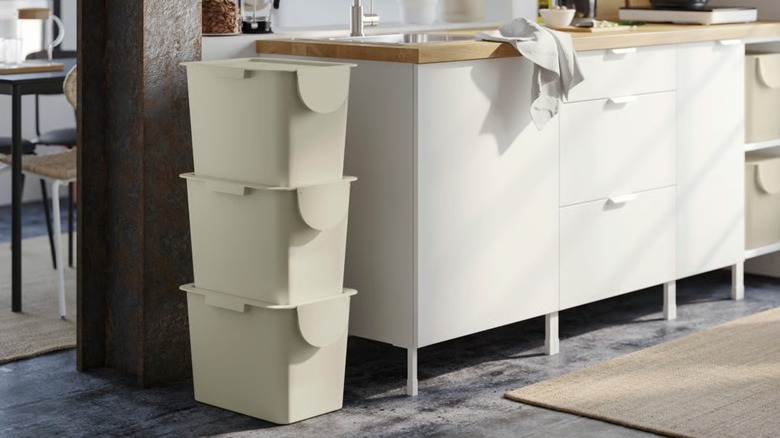 Stack of TRÖSKNING Bins next to kitchen counter