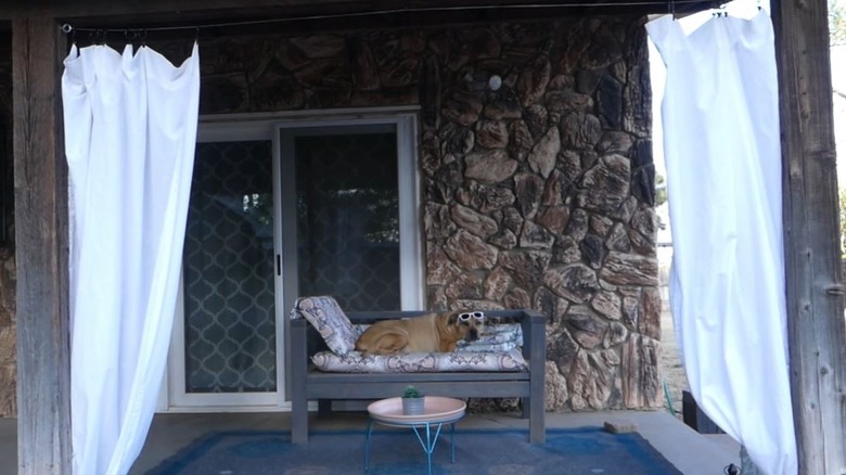 porch with bedsheet curtains for privacy hack