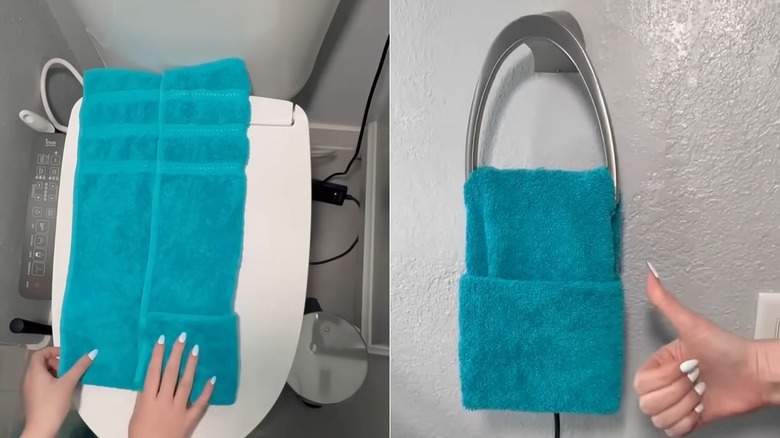 Hands folding a blue towel on a toilet/Blue folded towel on towel ring