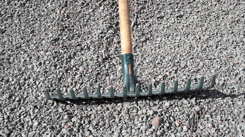 Bow rake upside down to smooth gravel in place