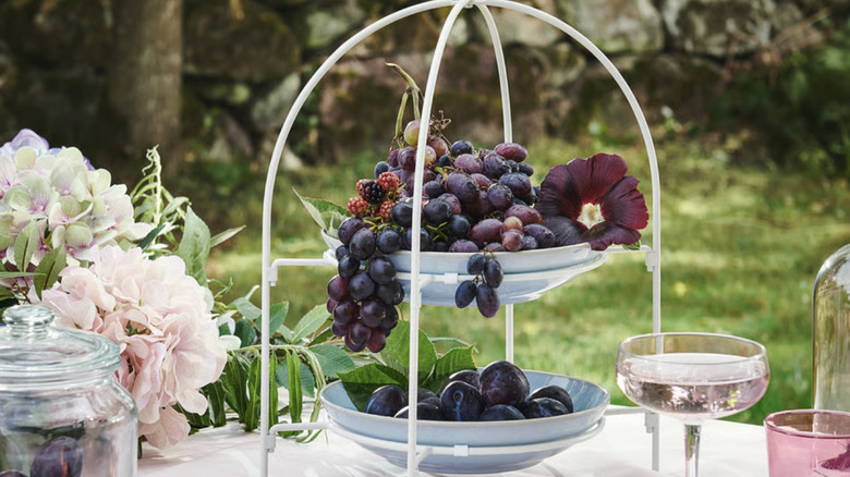 TOFSAND plate stand on an outdoor dining table