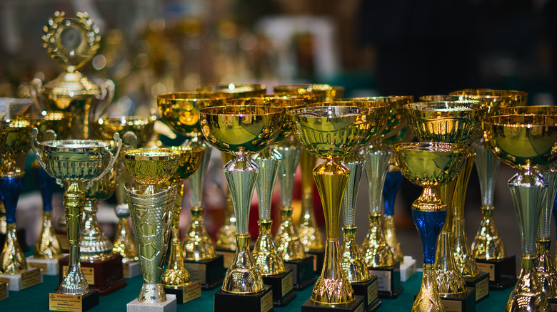 A collection of glittering gold trophy cups