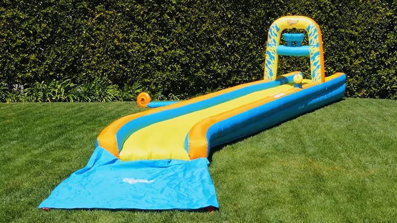 An inflated Wham-O Slip 'N Slide on a lawn