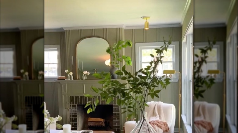 Living room with earthy green colors and textured walls
