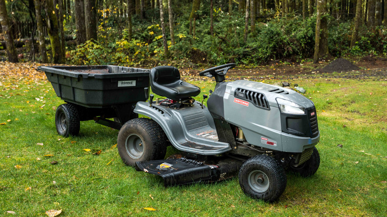 Riding lawn mower with a trailer attachment on the back