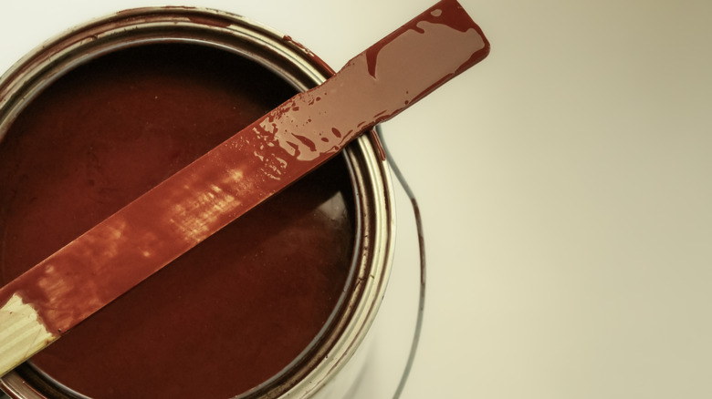 An open can of brown paint