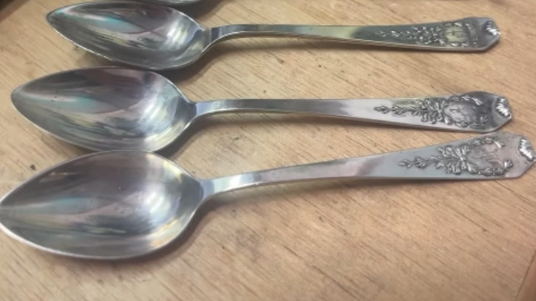Trio of Whiting spoons on a desk