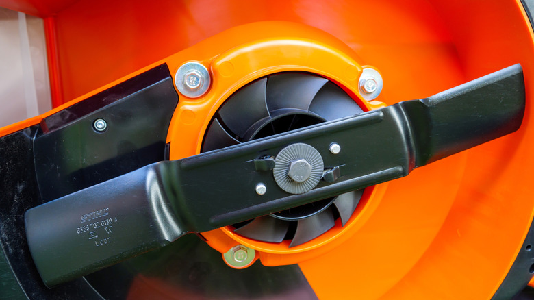 Close-up of a new blade attached to a mower